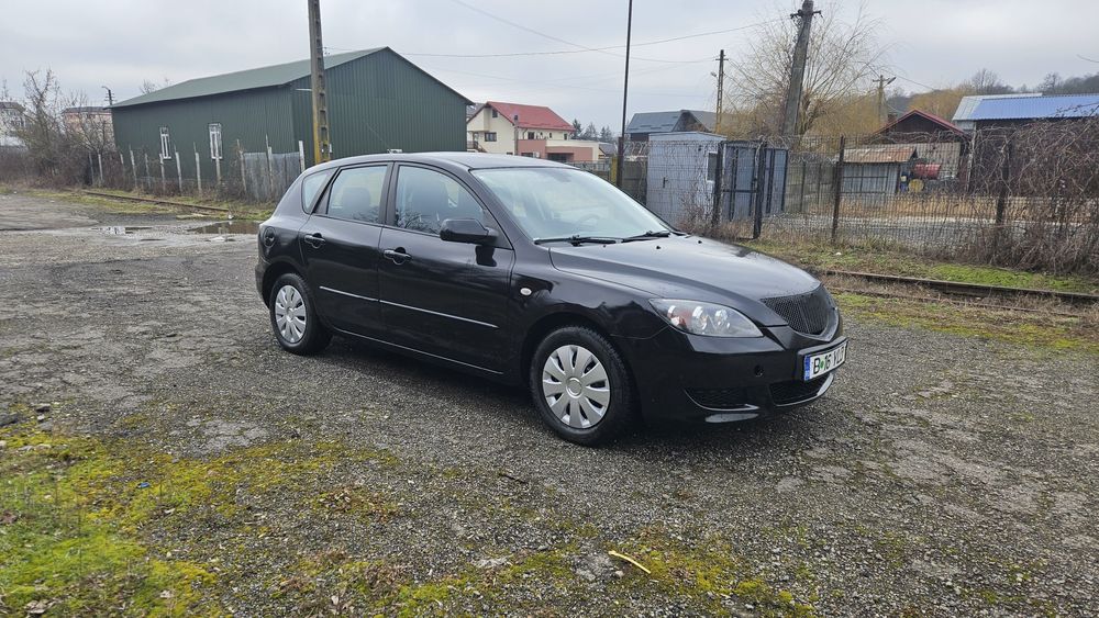 Mazda 3  an 2008 1.3 benzina
