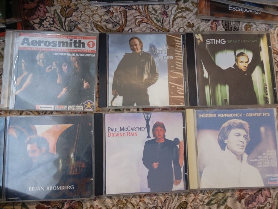Cd дискове с рок музика и класика