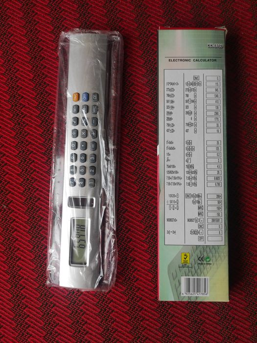 Calculator electronic cu fotocelulă și riglă în centimetri și inch
