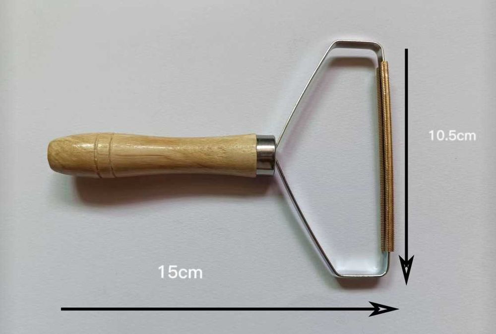 Ръчен уред за премахване на мъх и топчета от дрехи