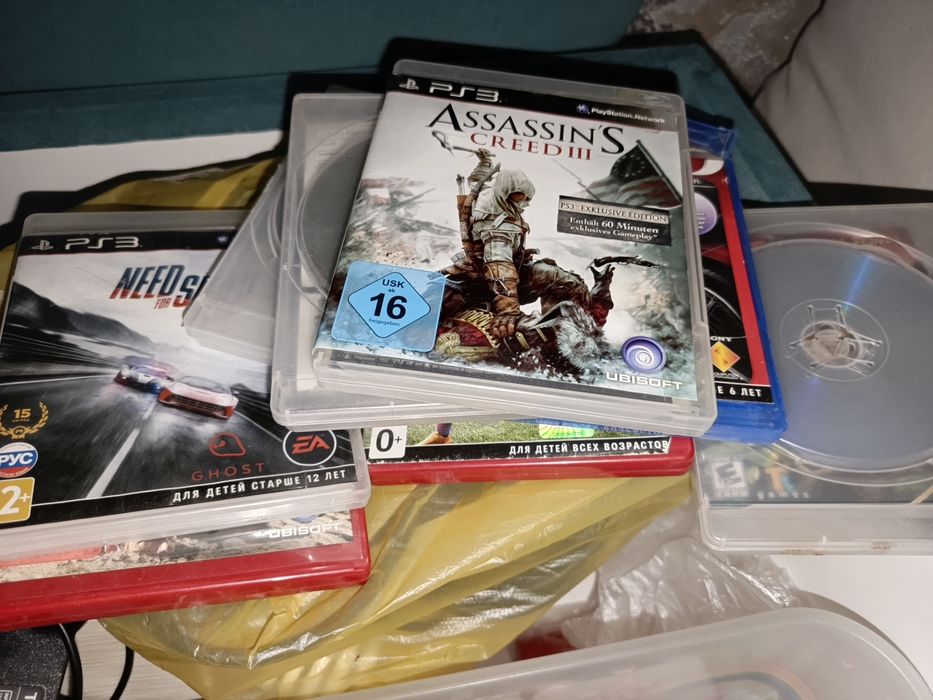 Продам PlayStation 3,руль ,и диски.