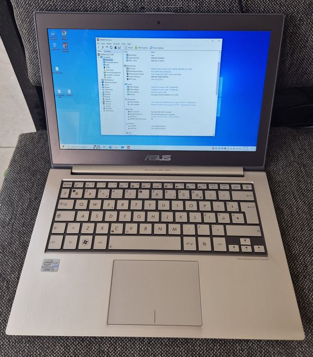 vand laptop Asus UX31E..14"..i5..Ssd 128 Gb..f. subtire..carcasa metal