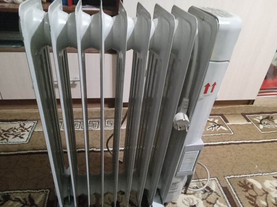 Продам масляный обогреватель секций