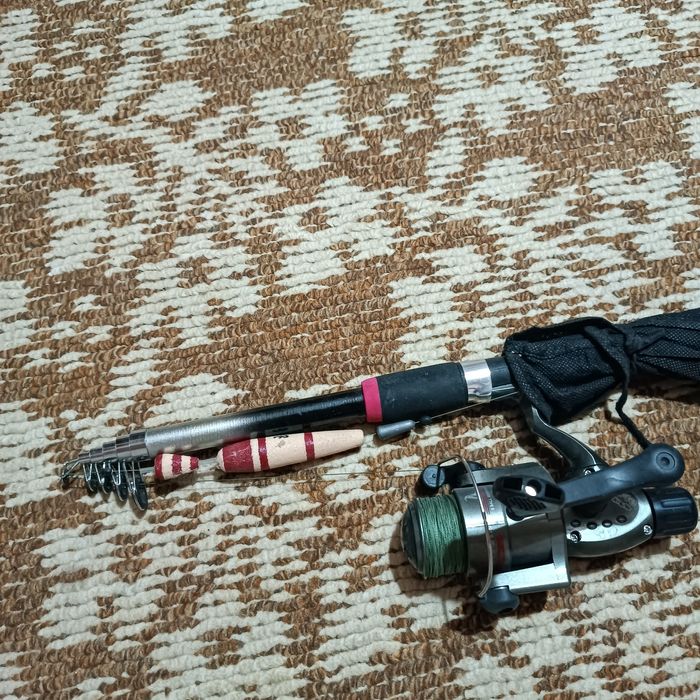 Удочка вместе с катушкой