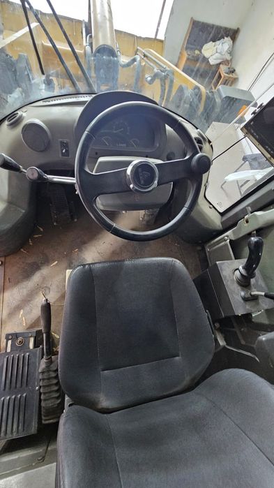 Продам фронтальный погрузчик б/у