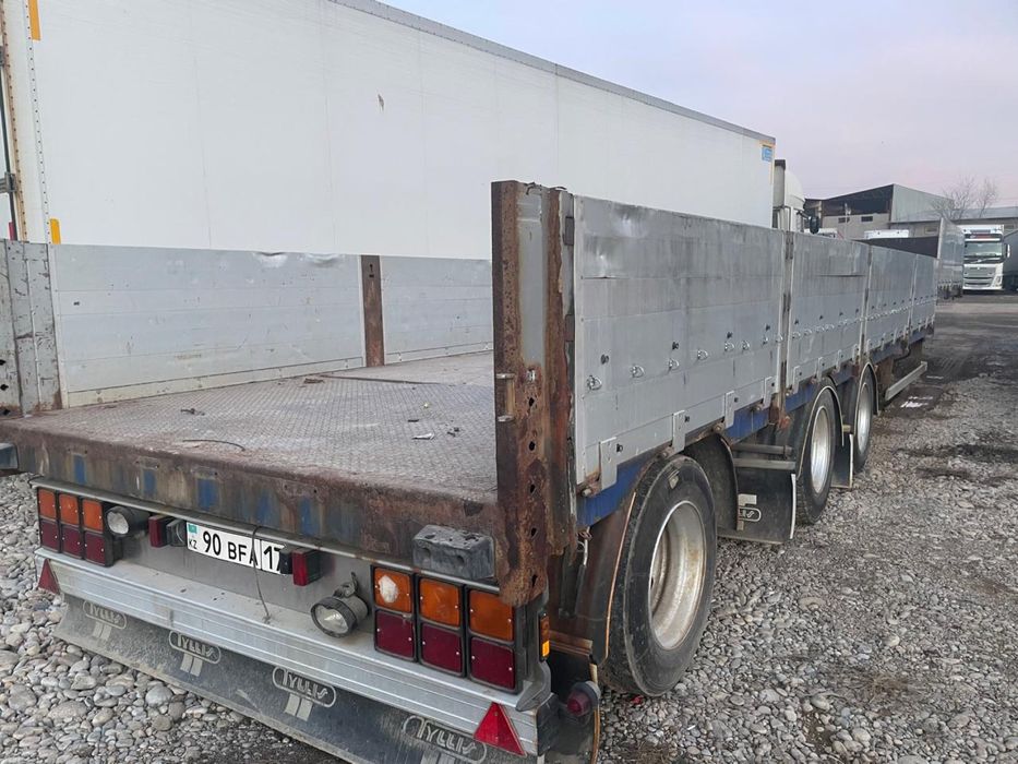 Полуприцеп с бортами Tyllis тяжеловоз