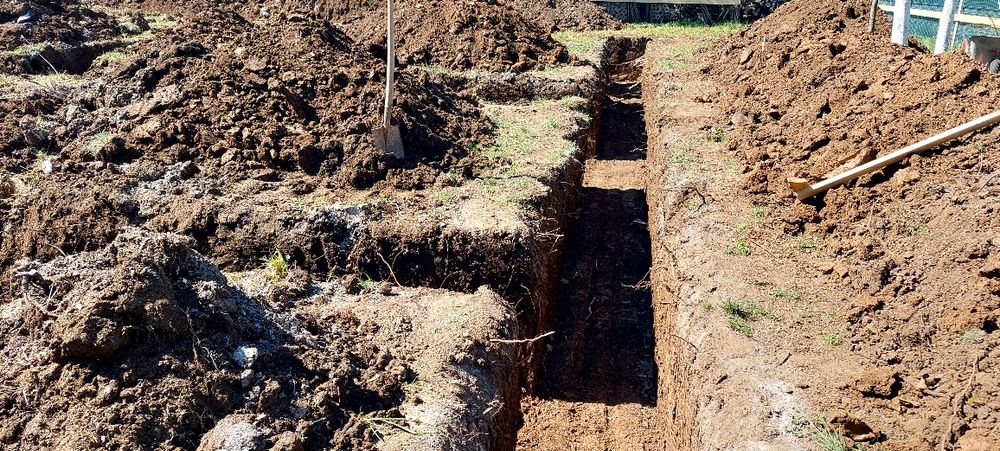 defrisari teren cu buldoexcavator