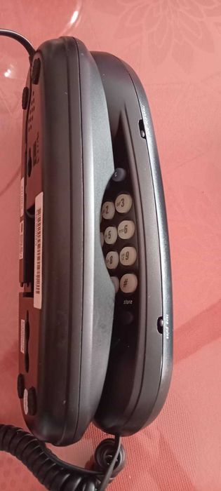 Телефон слушалка за стена