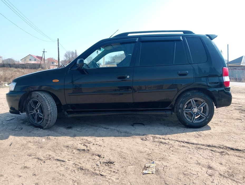 Мазда демио 2003 года