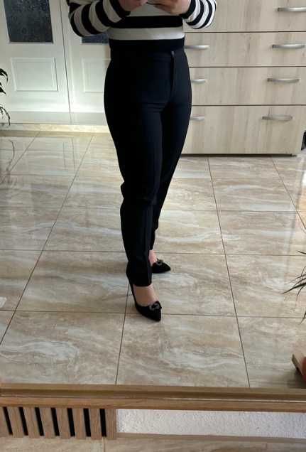 Pantaloni conici din stofa