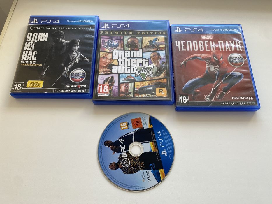 Sony PlayStation 4 Slim 1TB + 2 джойстика + 4 диска