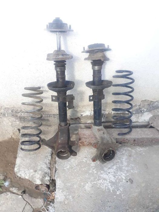 Форд эскорт .Стойки ,пружина