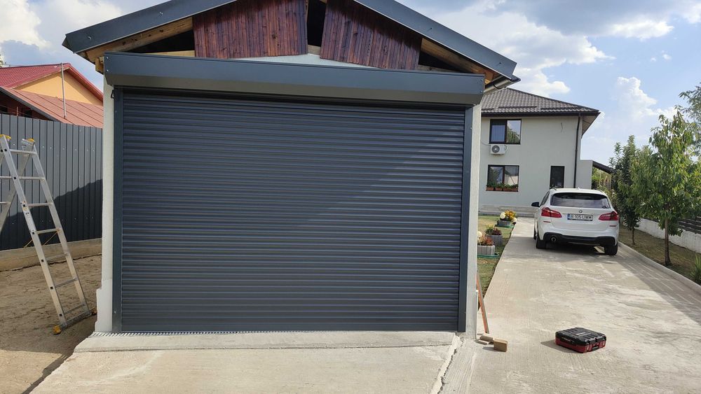 Montaj usi garaj sectionale, automatizari porti, preturi producator