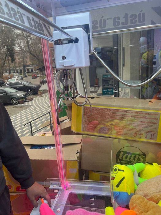 Игрушка хватайка аппарат
