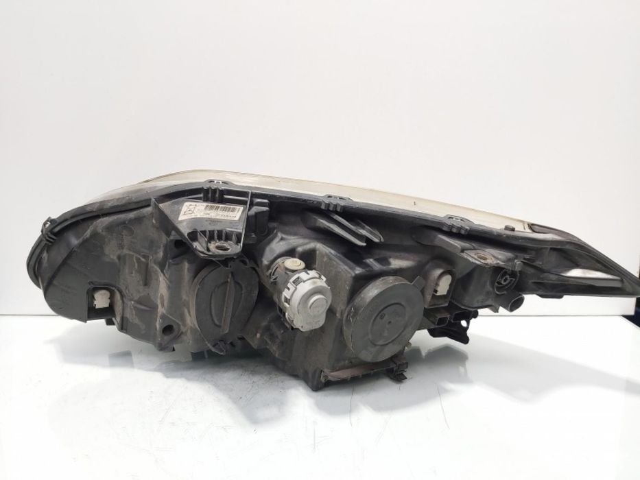 Far dreapta cu lupa si xenon, Renault Laguna 3 vol pe stanga piesa originala