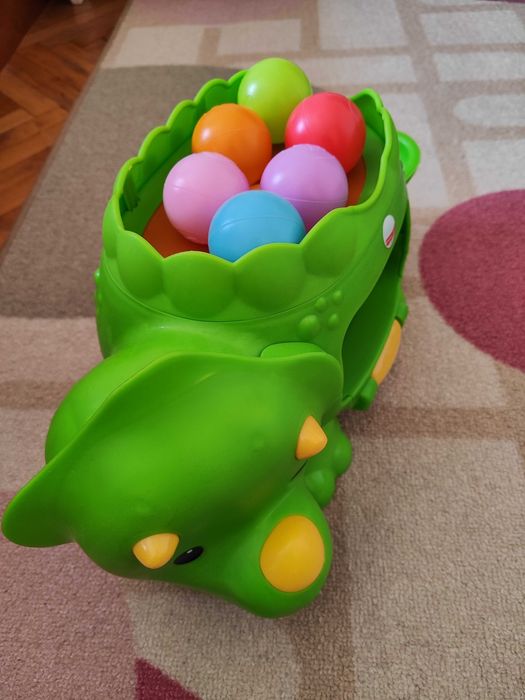 Играчка динозавър с топчета Fisher Price