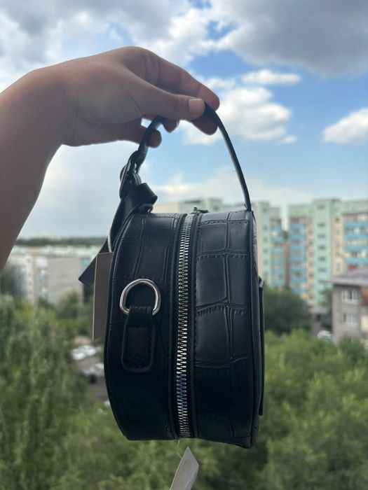Круглая новая сумка