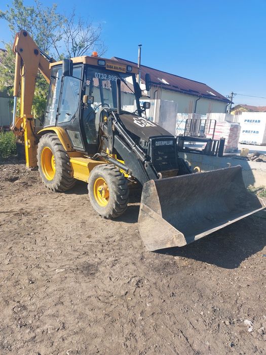 Buldoexcavator Caterpillar