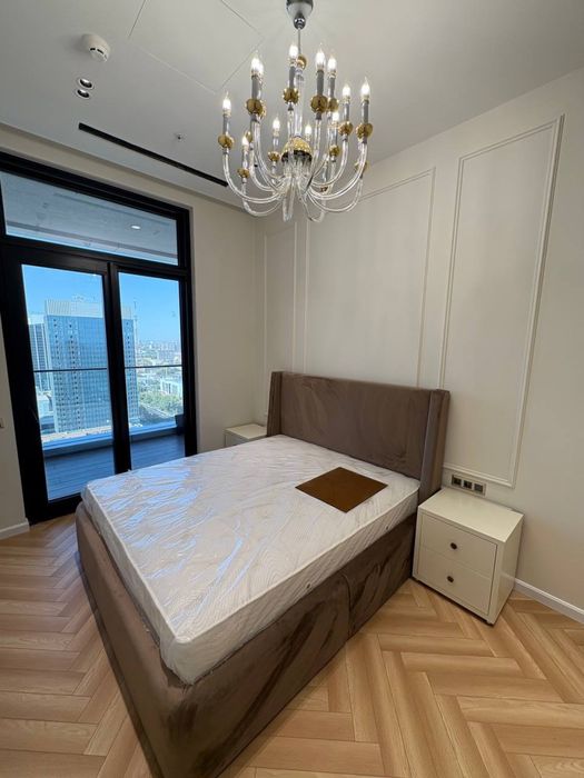 NestOne квартира 23 этаж 59м Блок А. Балкон в Ташсити парк смотрит