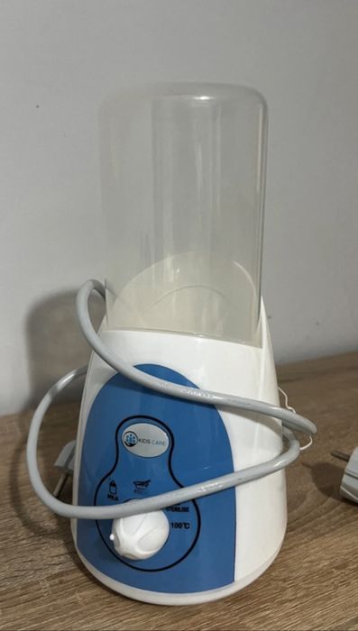 Încălzitor biberoane  5 în 1 pentru mașină și casă Kidscare