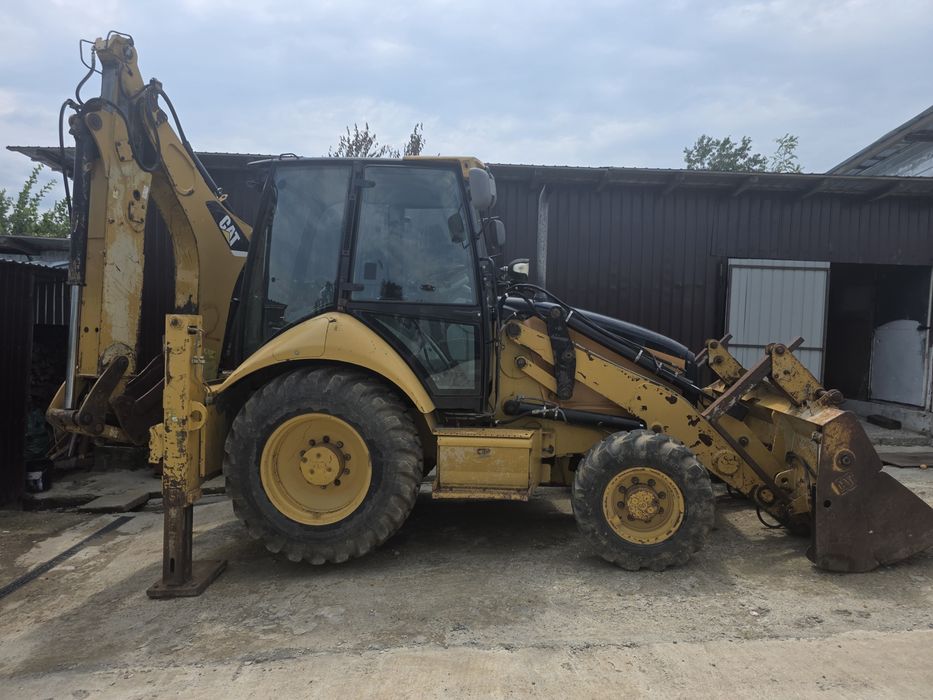 Vand Buldoexcavator Caterpillar