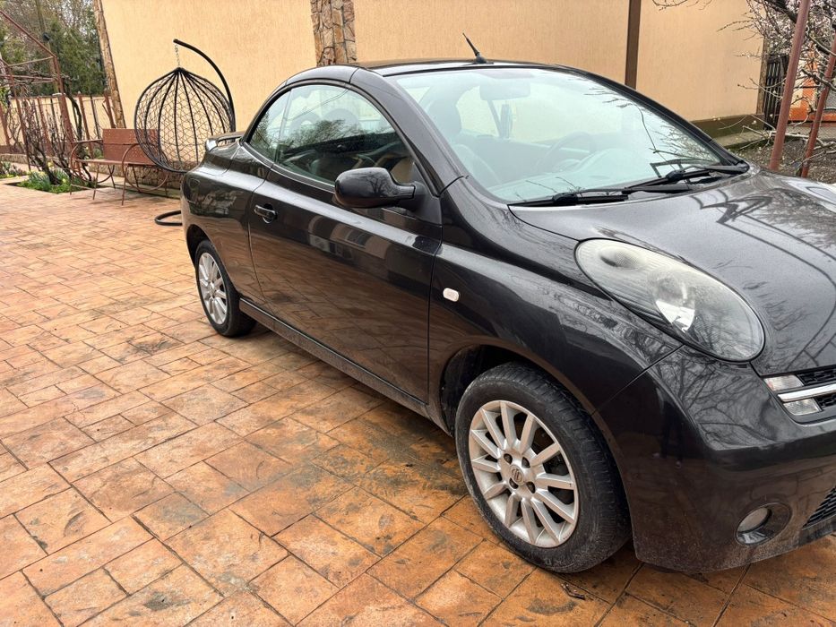 Nissan Micra 1,6 benzina decapotabil,  impecabil  Accept schimb cu  autoturisme s-au cu oi.