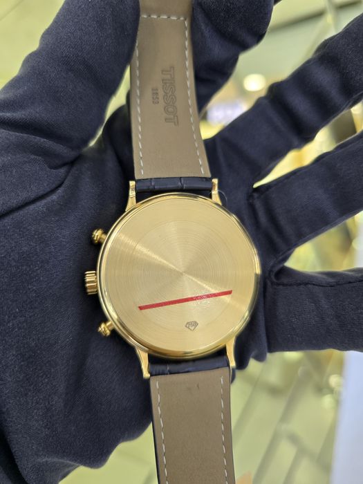 Продам золотые часы Tissot 750 пробы
