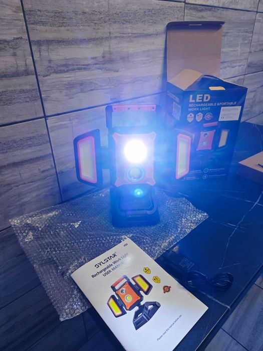 SYLSTAR Proiector LED reîncărcabil 40W 4000LM cu clemă, pliabil și rotativ la 360° cu 5 moduri