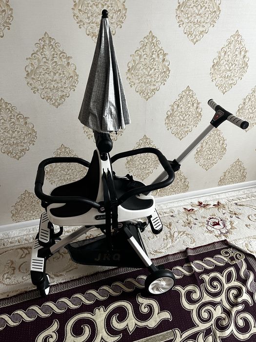 Екі балаға арналған коляска