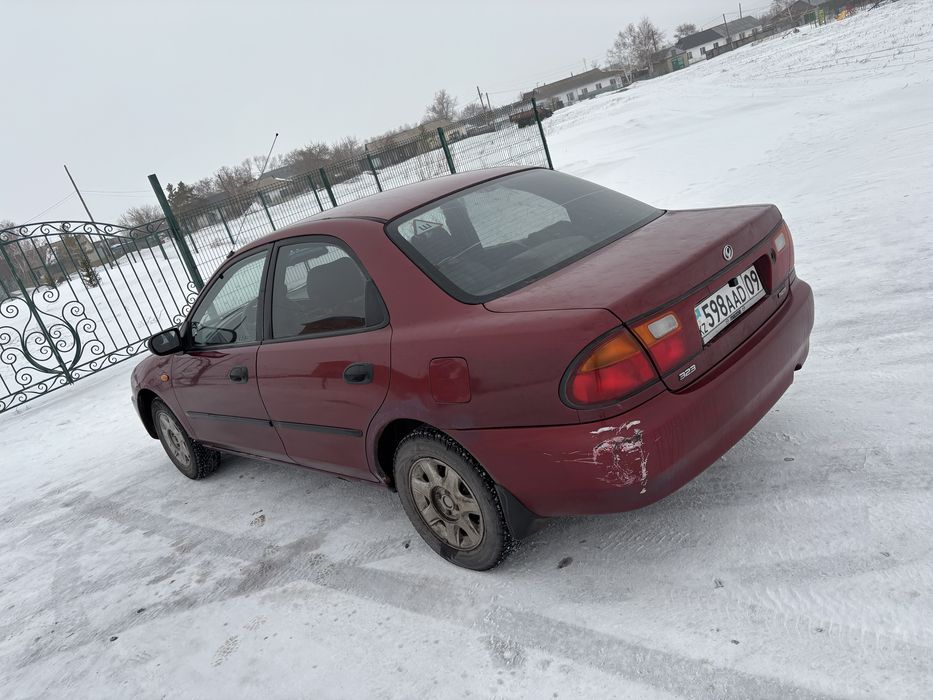 мазда 323 ba владеет женщина