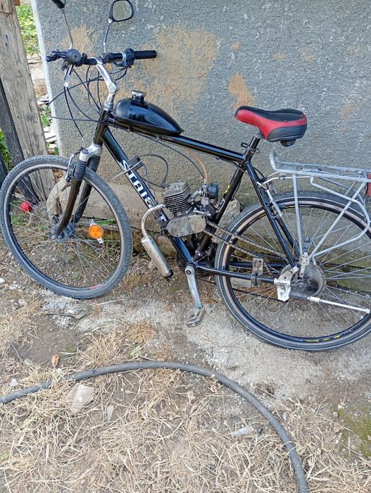 La schimb bicicletă cu motor ăn 2 timpii