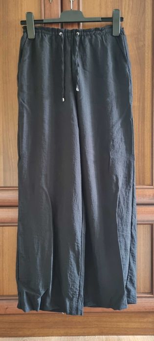 Pantaloni cu crac larg