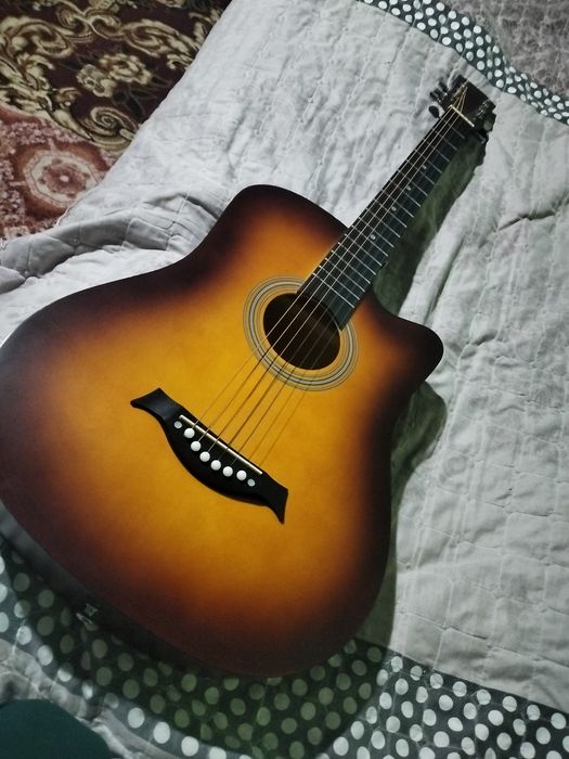 Gitara akustik mawkala yozmela