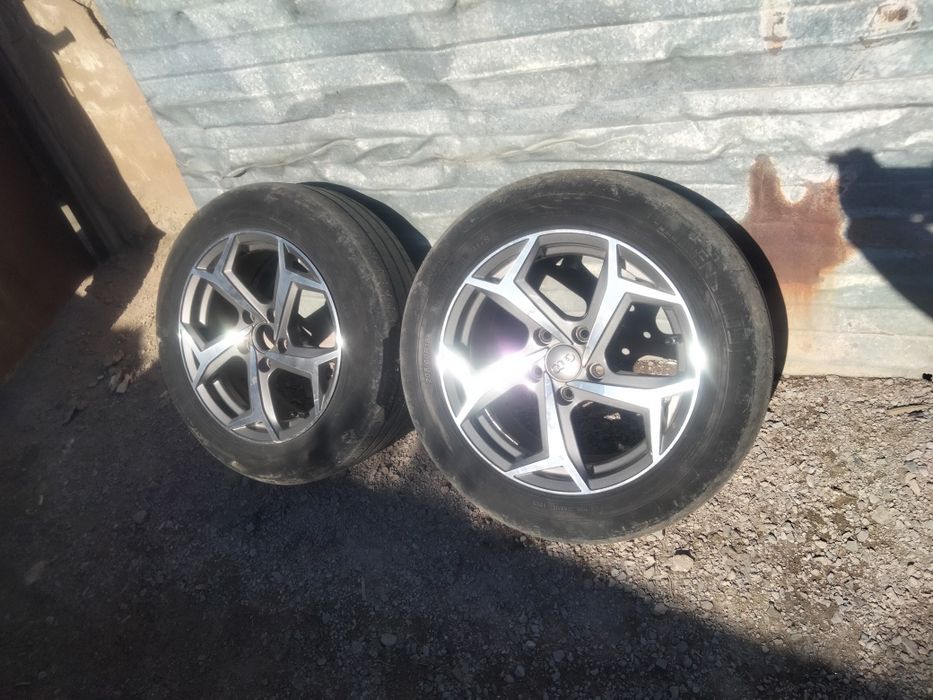 Продам титановые диски в идеале почти новые с шинами