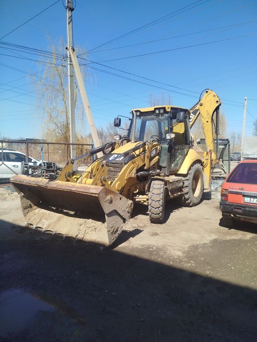 Аренда услуги экскаватора погрузчика Сат 428F