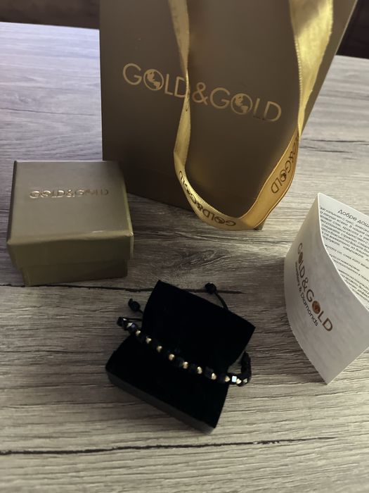 Златна гривна с оникс