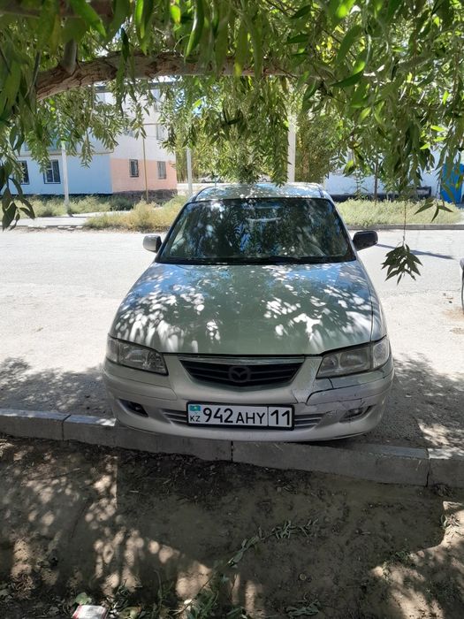 Мазда 626 птичка