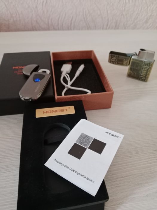 Продам оригинальную зажигалку Honest с электронной зарядкой