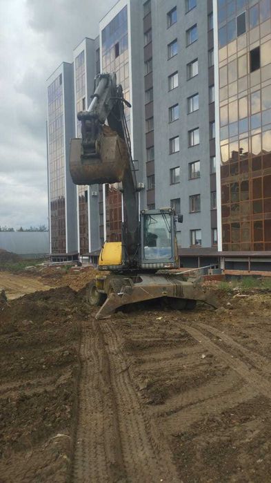 Аренда, услуги колёсного экскаватора