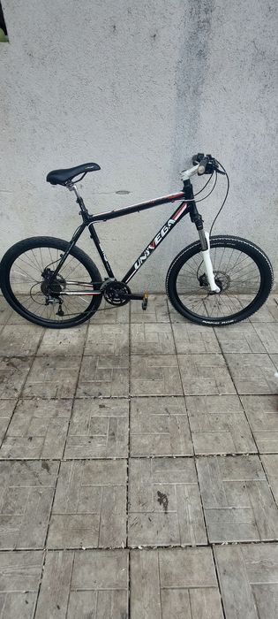 Vind bicicleta Univega,  frână hidraulică  pe  disc, shimano  .
