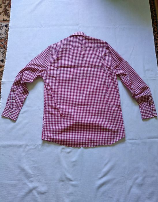 L. 100 % bumbac. Aproape nouă.