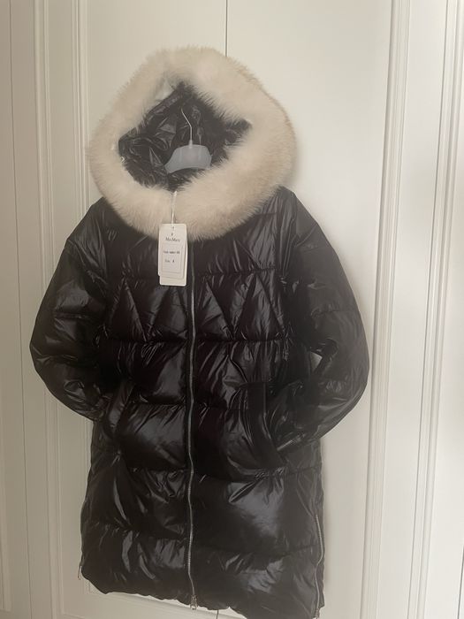 Продам пуховик новый