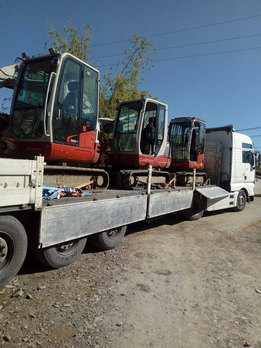 Transport marfă  transport utilaje buldoexcavator platforma trailer