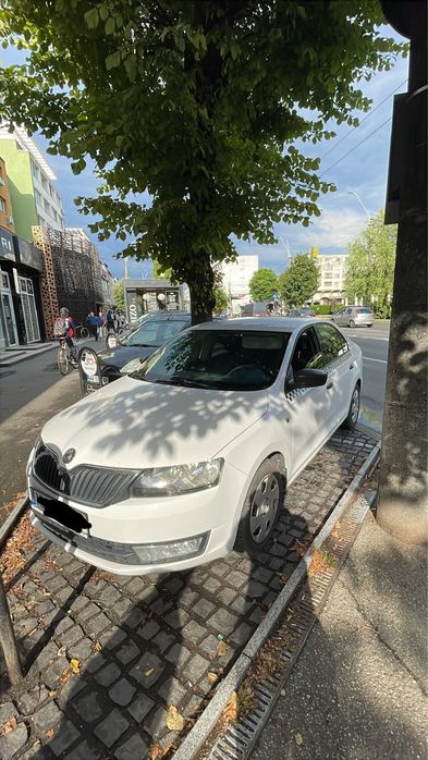 Skoda Rapid cu firma taxi