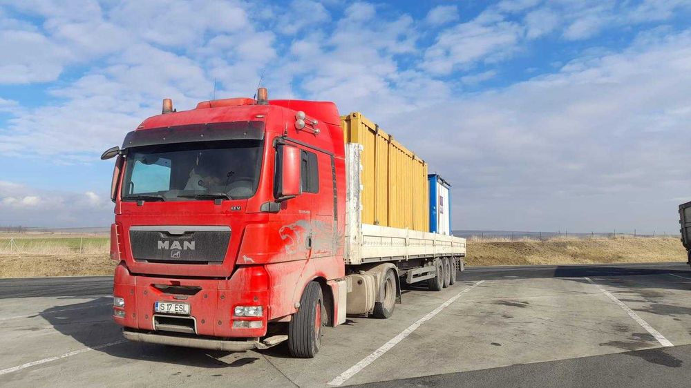 Transport marfă  transport utilaje buldoexcavator platforma trailer