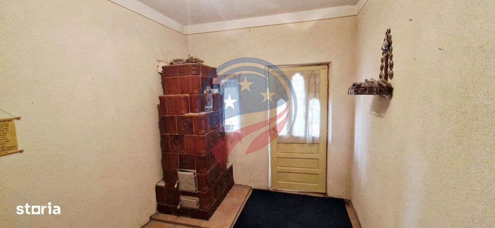 Casa Bradesti  teren  intravilan 7952 mp  deschidere 33 m la DE 70