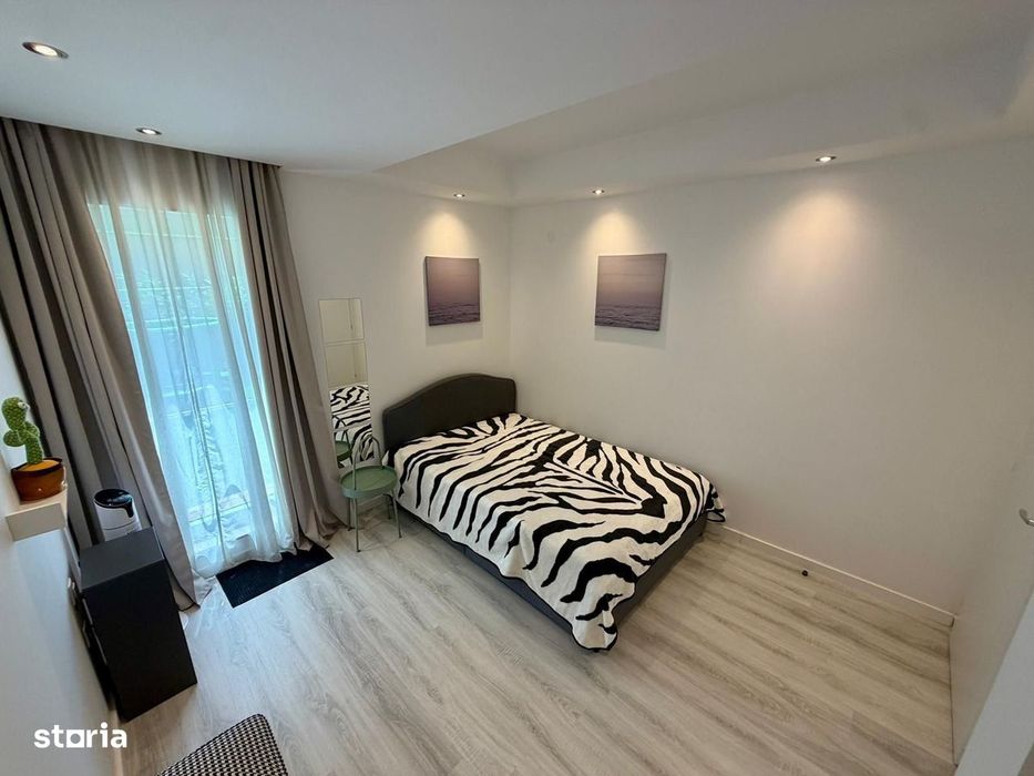 COSMOPOLIS - Apartament cu 3 camere si gradina, mobilat si utilat.