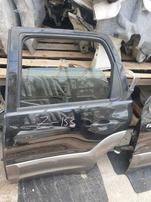 Дверь Mazda Tribute