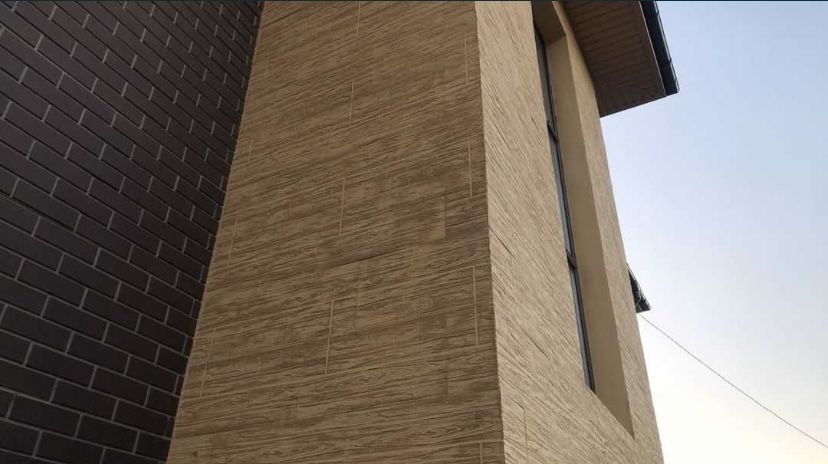 фасадные панели под травертин для вашего дома