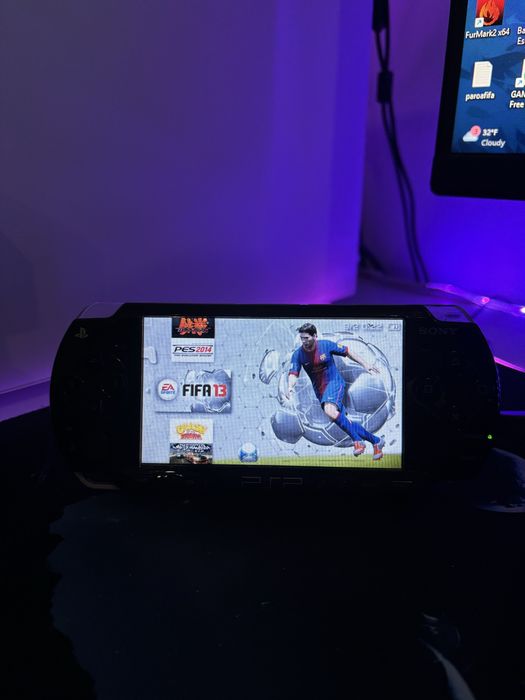 PSP 2003 Modat, Impecabil, cu multe jocuri si card de 64 Gb